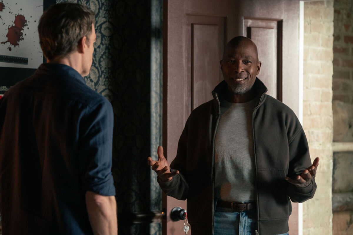 Michael C. Hall as Dexter Morgan and Ntare Guma Mbaho Mwine as Blessing Kamara in Dexter: Resurrection, episode 1, season 2